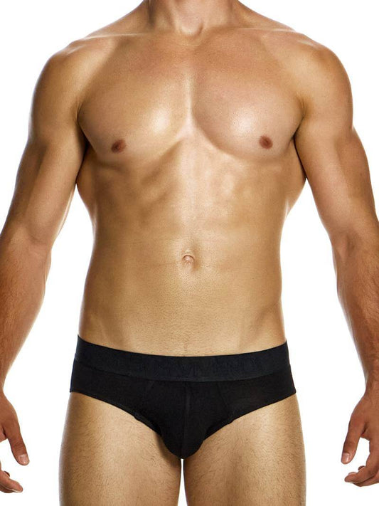 A model wearing a blue pair of Modus Vivendi bamboo classic briefs, with the brand's name visible on the waistband.
