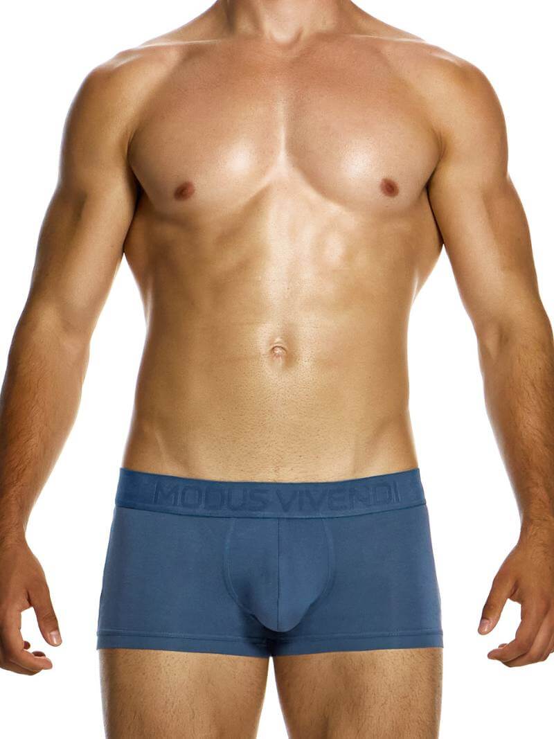 A model wearing green Modus Vivendi bamboo boxer briefs with a low-rise waistband and branded waistband.