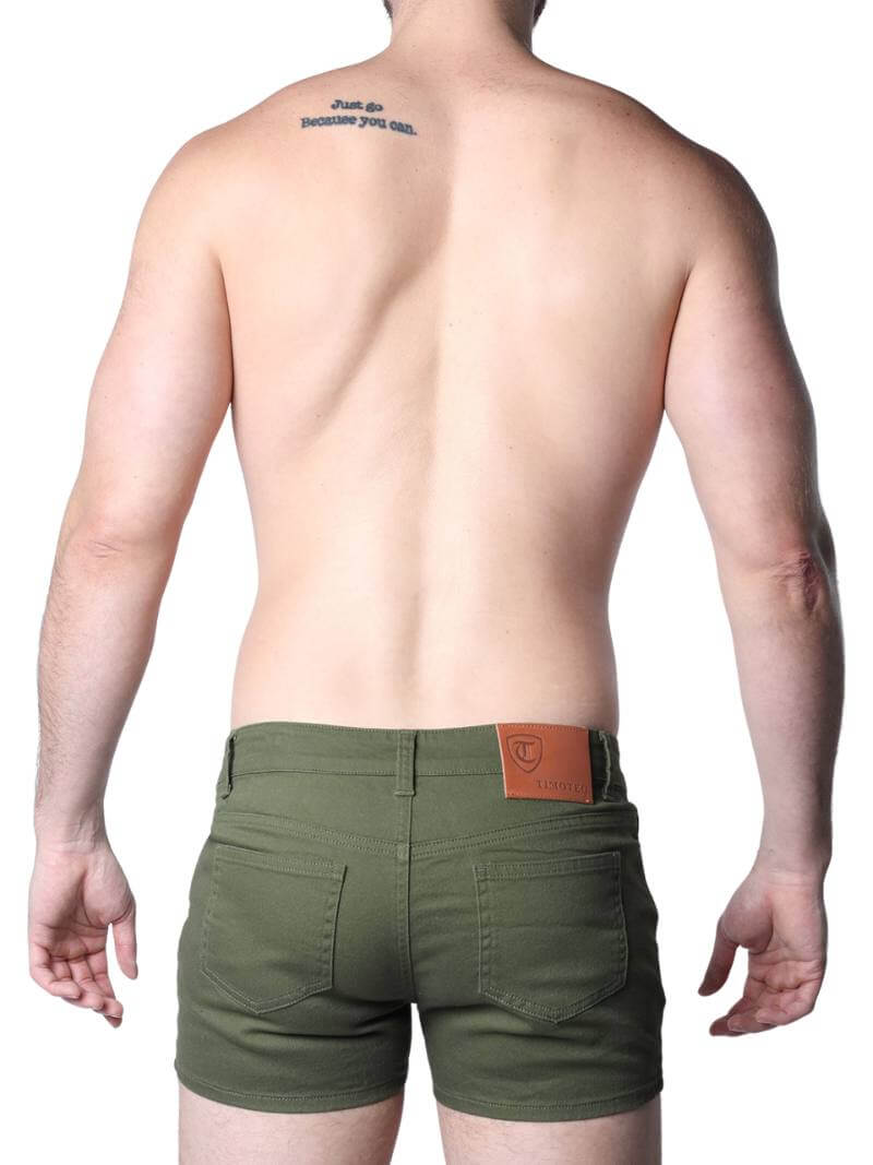 Green shorts worn by a person on a white background