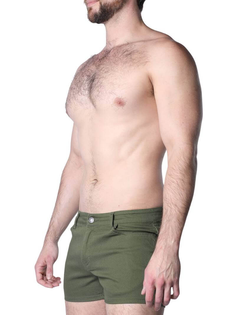 Green shorts worn by a person on a white background
