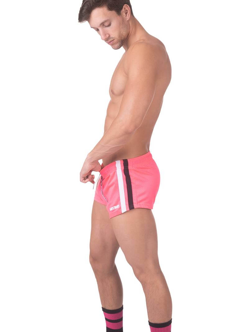 A model wearing royal blue short-legged shorts with sporty side stripes and a drawstring waist.