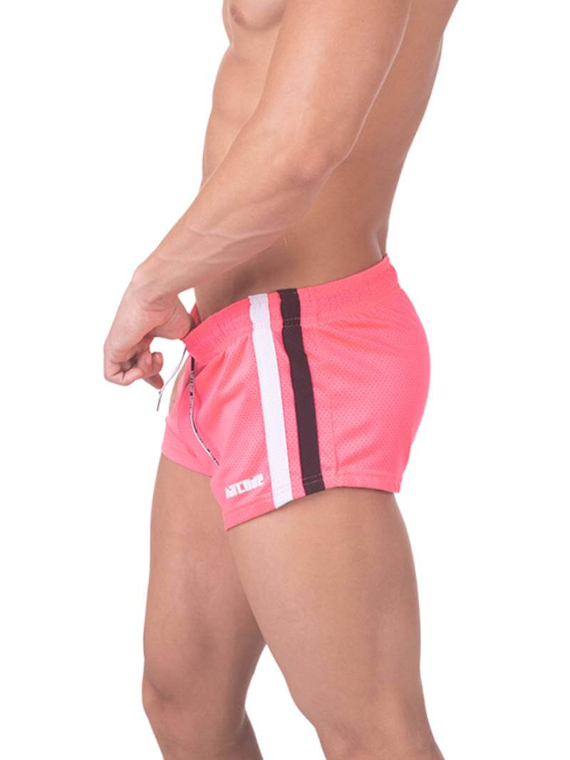 A model wearing royal blue short-legged shorts with sporty side stripes and a drawstring waist.