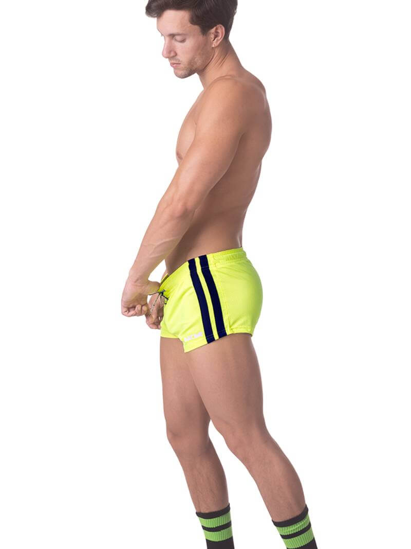 A model wearing royal blue short-legged shorts with sporty side stripes and a drawstring waist.