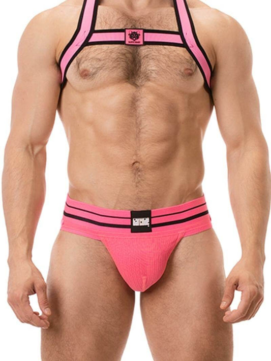 A model wearing a pink BARCODE Berlin Andreus jockstrap, with the brand label visible on the striped waistband, showcasing the product's design and fit.