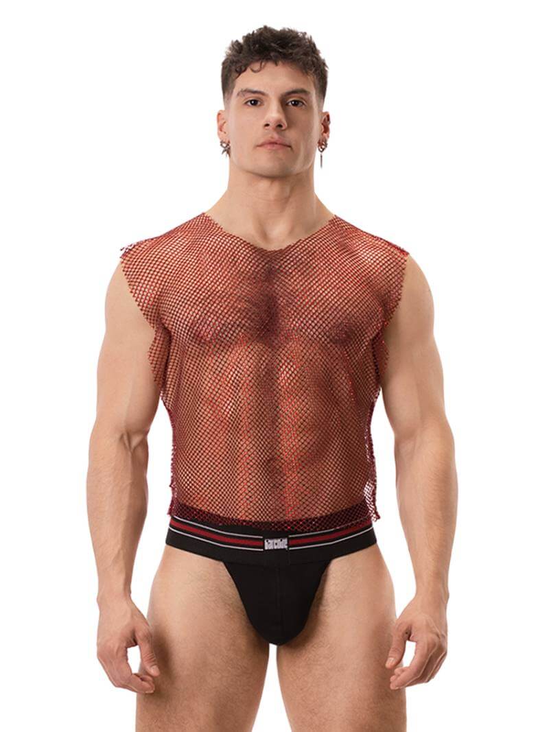 A male model wearing a sleeveless, round neck, mesh tank top in red with glitter accents, paired with black shorts with red trim. The tank top has a clubwear and partywear style, semi-see-through with a shimmering effect.