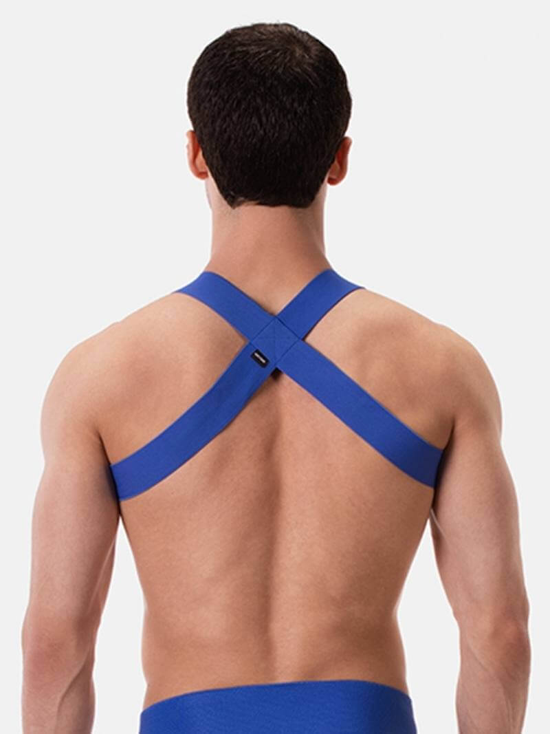 A man wearing a white elastic chest harness with straps across the chest and over the shoulders.