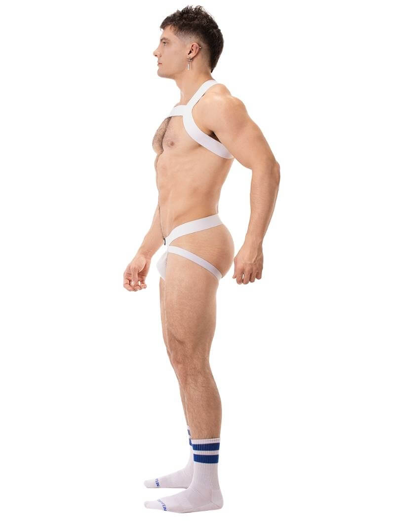 A man wearing a blue elastic chest harness with straps across the chest and over the shoulders.