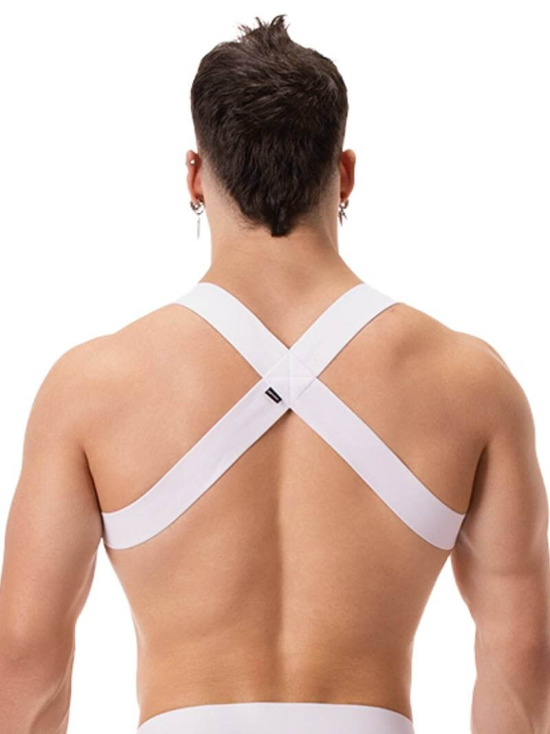 A man wearing a blue elastic chest harness with straps across the chest and over the shoulders.