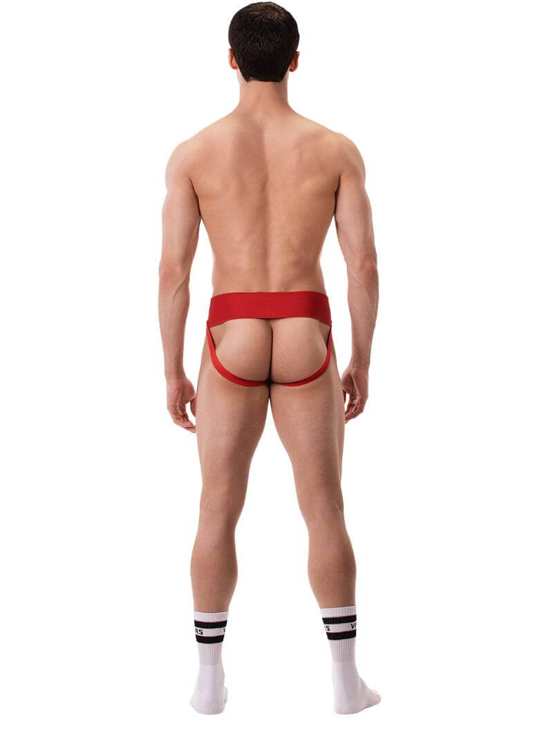 A model wearing a white Barcode Berlin Sergey ribbed cotton jockstrap, with the brand label visible on the waistband.