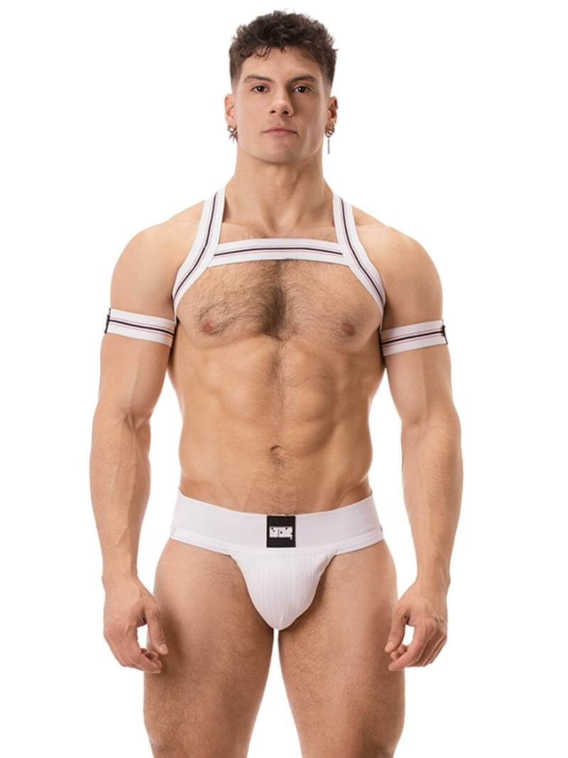 A model wearing a blue Barcode Berlin Sergey ribbed cotton jockstrap, with the brand label visible on the waistband.