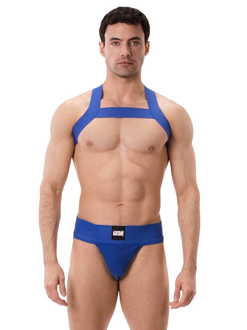 A model wearing a white Barcode Berlin Sergey ribbed cotton jockstrap, with the brand label visible on the waistband.