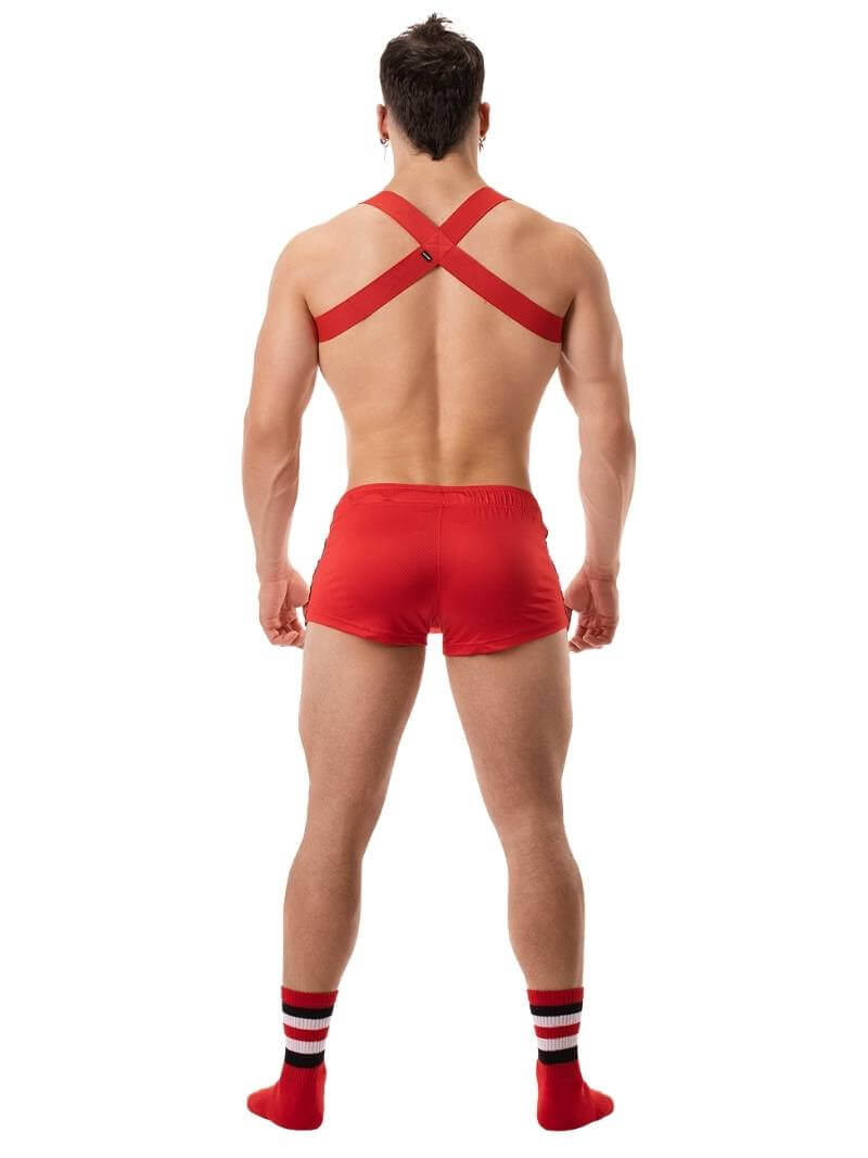 A model wearing black short-legged shorts with sporty side stripes and a drawstring waist.