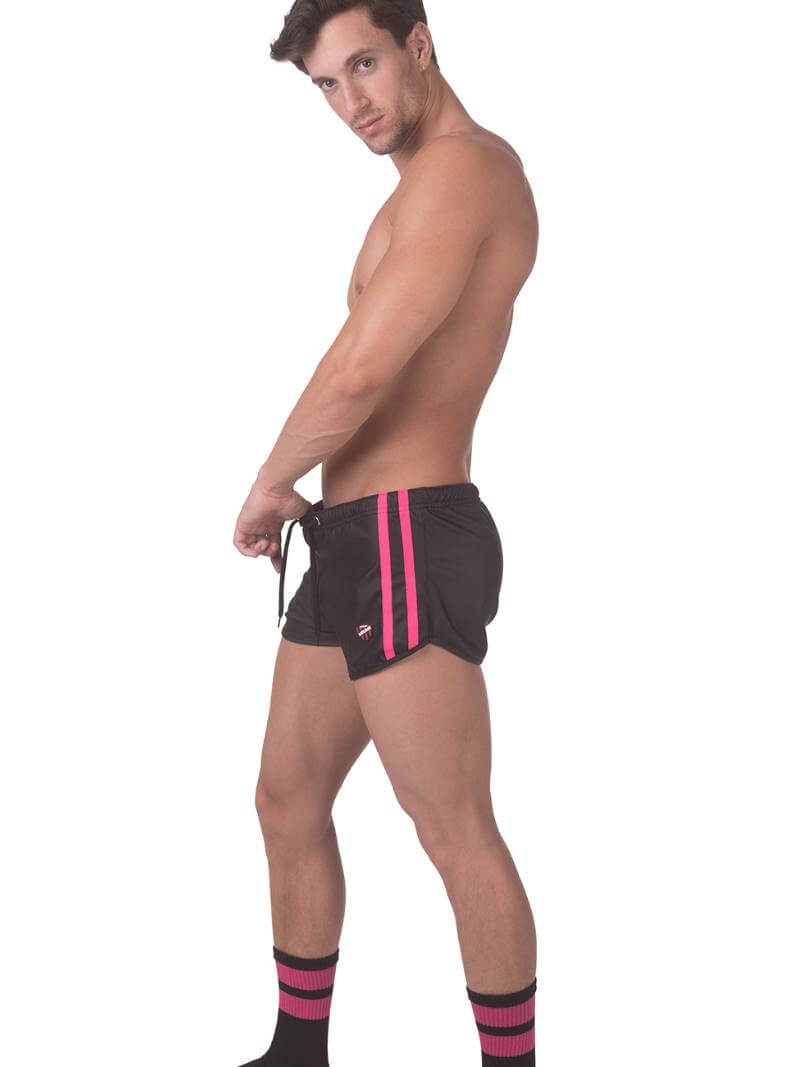 A pair of mid-calf black gym socks with colorful pride stripes on the cuff, featuring the Barcode Berlin brand logo.