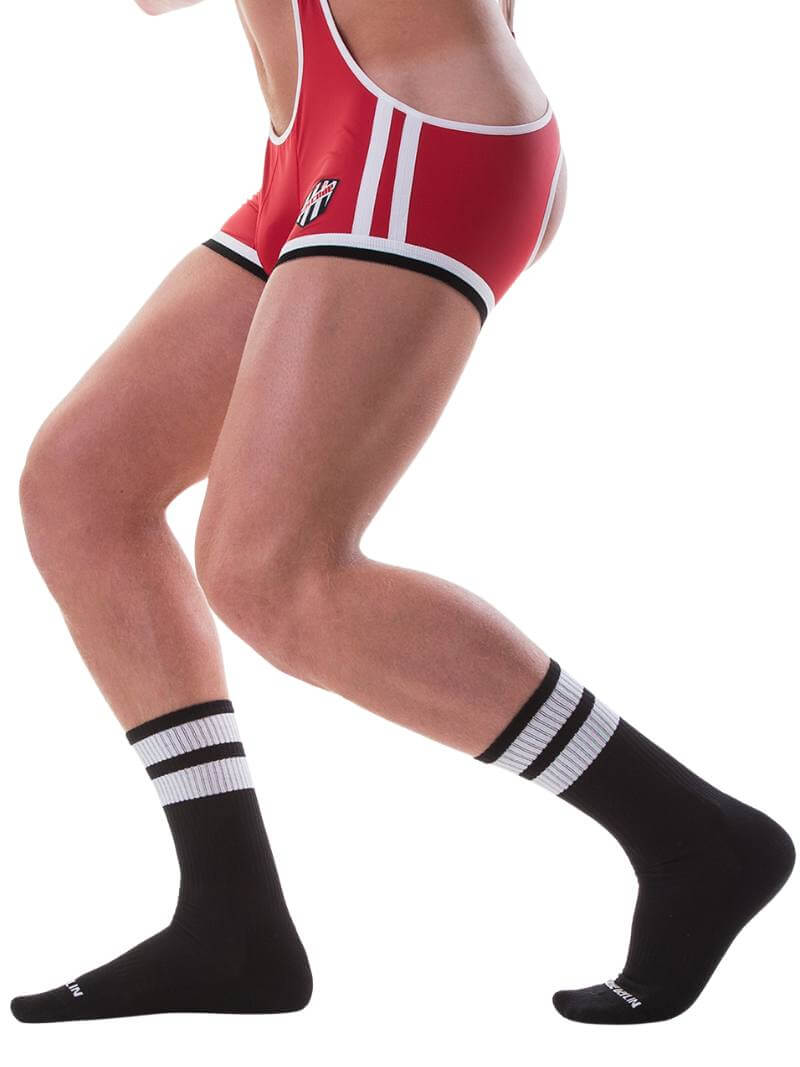 A pair of black gym crew socks with yellow stripes, featuring the Barcode Berlin brand logo on the ankle area.