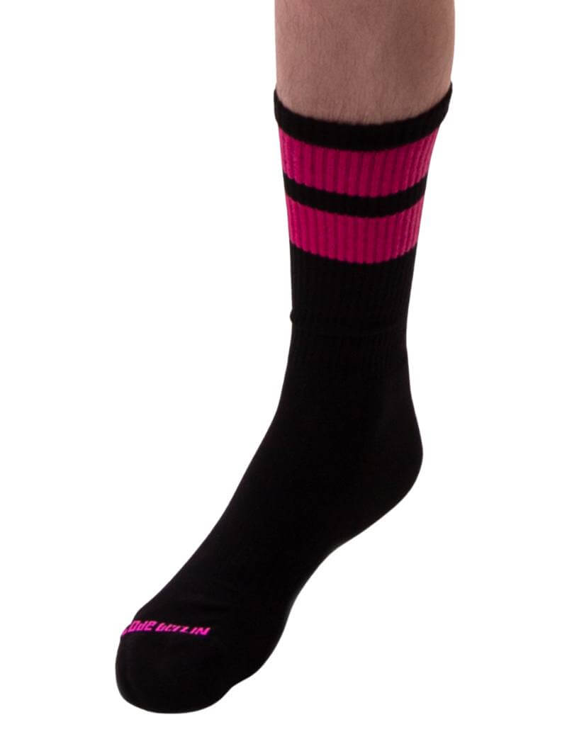 A pair of black gym crew socks with pink stripes, featuring the Barcode Berlin brand logo on the ankle area.