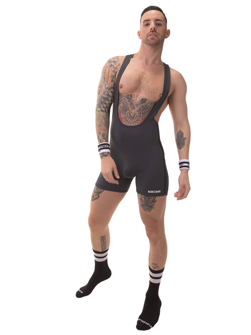 A man wearing a grey Barcode Berlin backless singlet with black stripes and a low-cut neck.