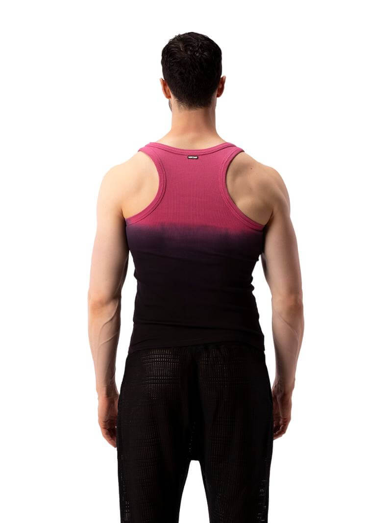 A male model wearing a sleeveless black tank top with a gradient of blue to pink and the text 'F**KING HOT' in the center, along with a 'BARCODE' branded label at the back.