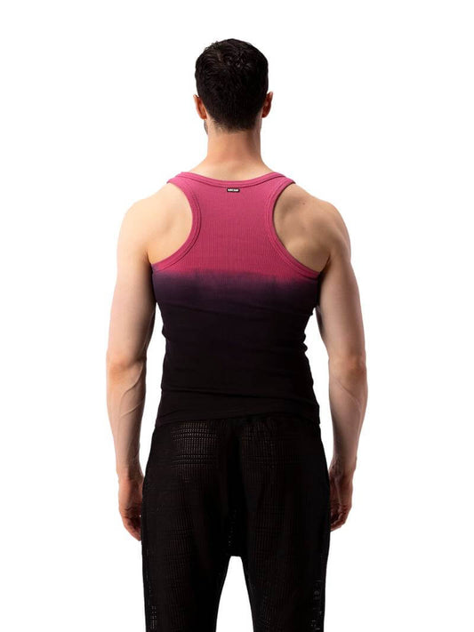 A male model wearing a sleeveless black tank top with a gradient of blue to pink and the text 'F**KING HOT' in the center, along with a 'BARCODE' branded label at the back.