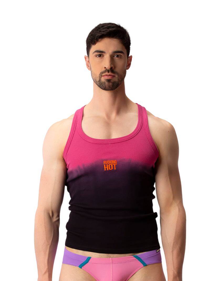 A male model wearing a sleeveless black tank top with a gradient of blue to pink and the text 'F**KING HOT' in the center, along with a 'BARCODE' branded label at the back.