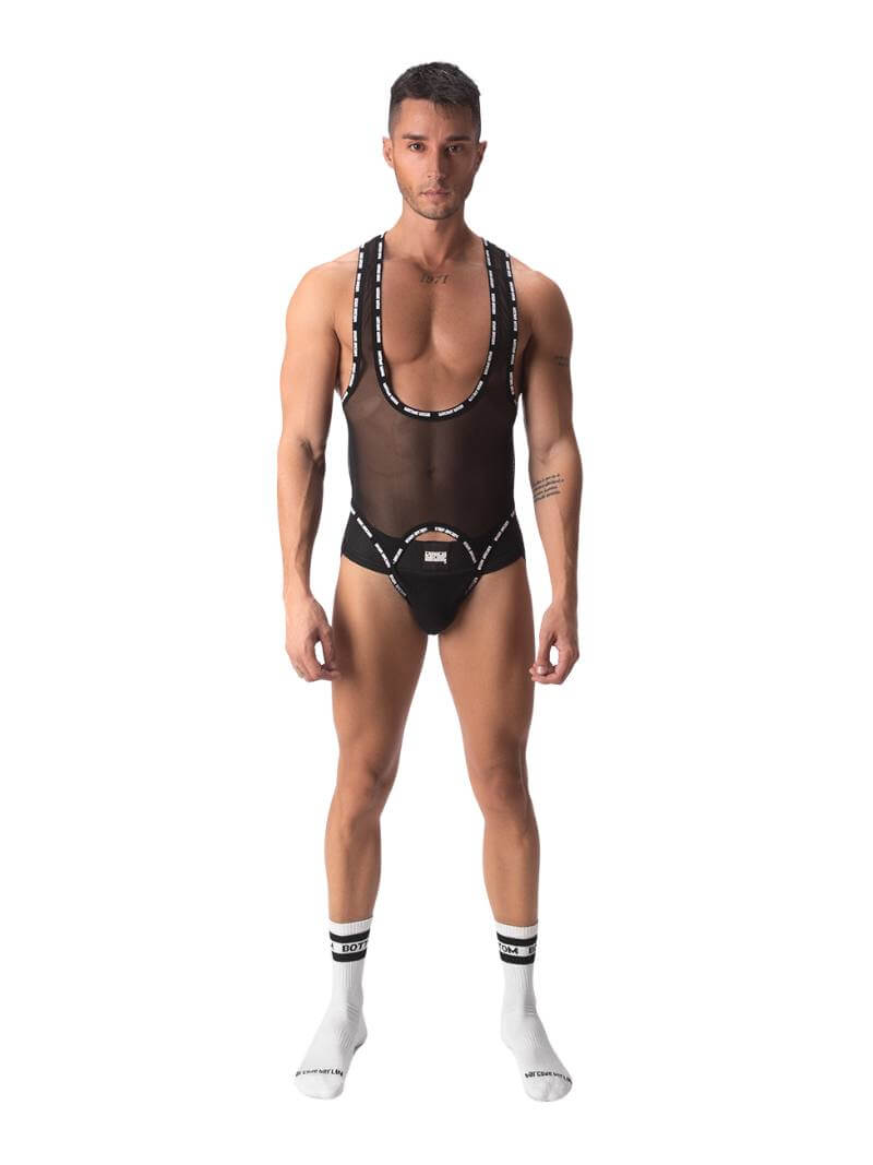A male model wearing a black sheer mesh Barcode Berlin singlet with branded trims, featuring a crotchless front and a jockstrap rear.