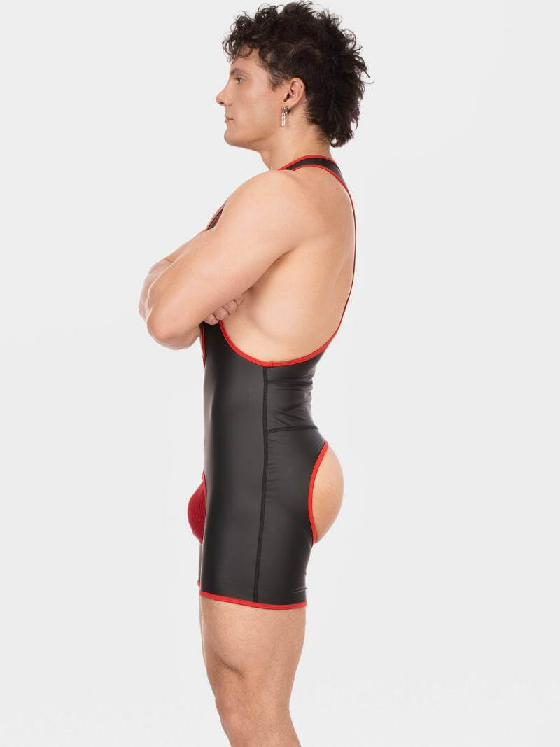Person wearing a black swimsuit with red accents on a white background
