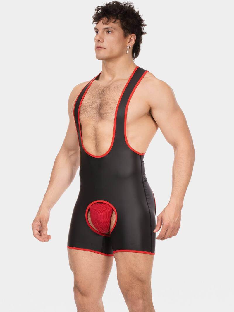 Man wearing a black and red wrestling singlet on a white background