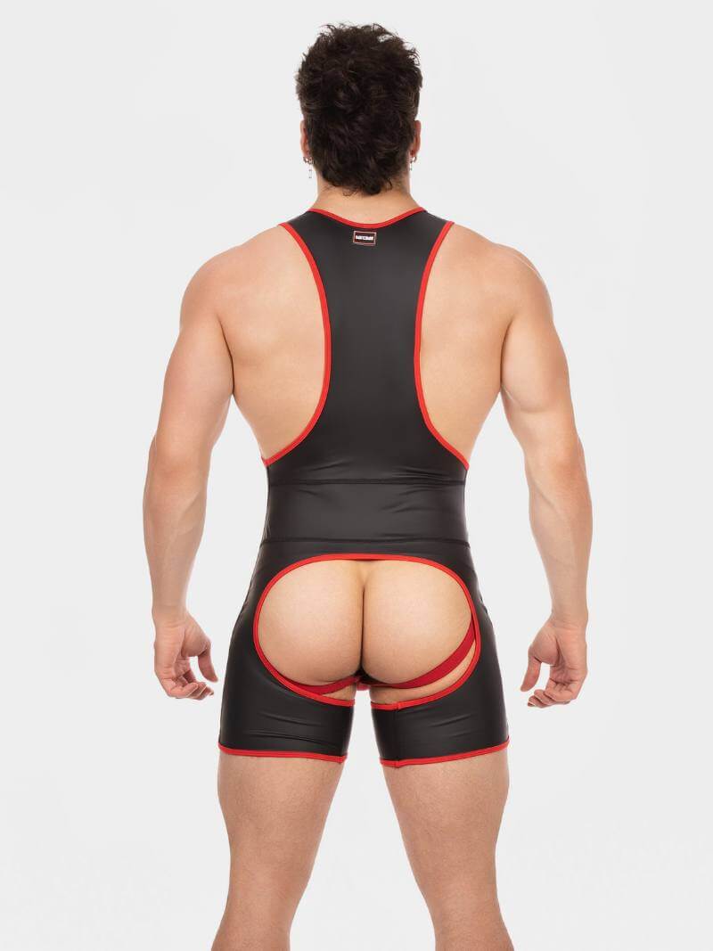 Person wearing a black and red wrestling singlet on a white background