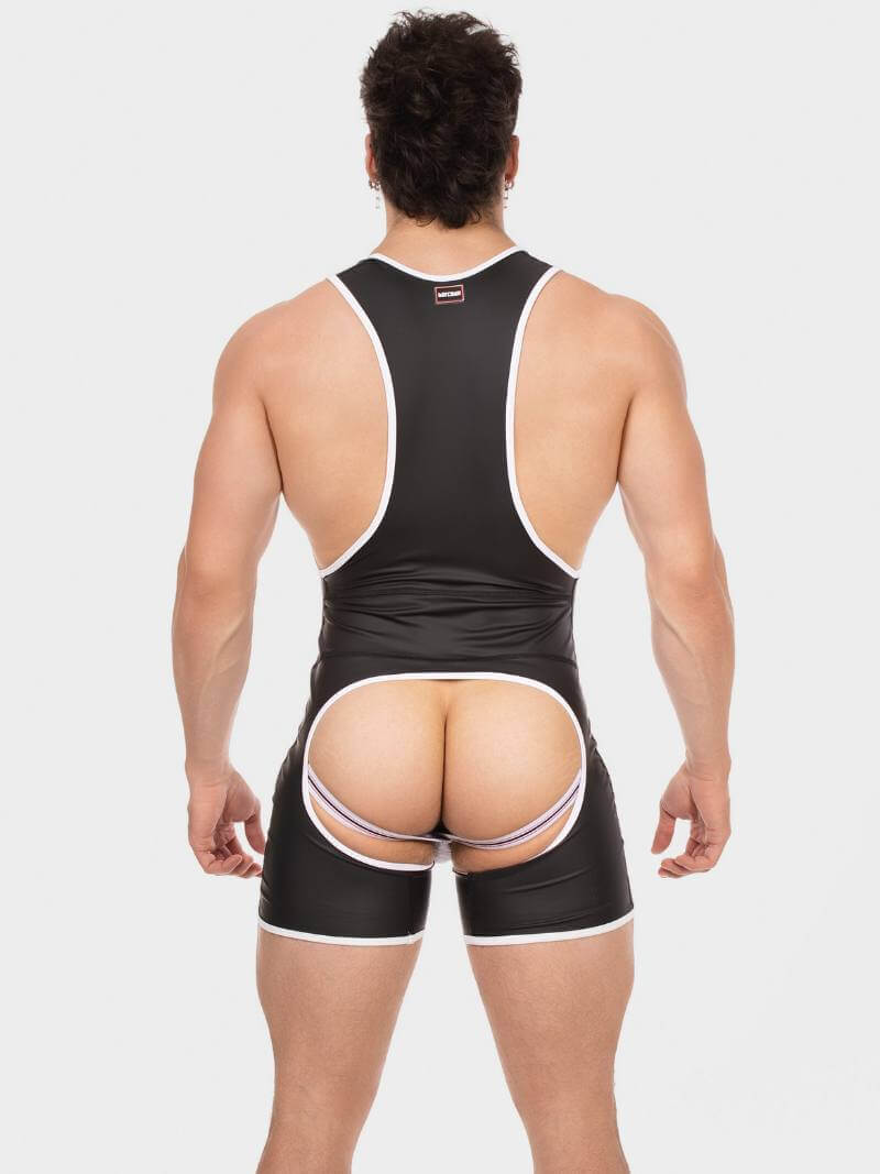 Person wearing a black wrestling singlet with white accents on a plain background