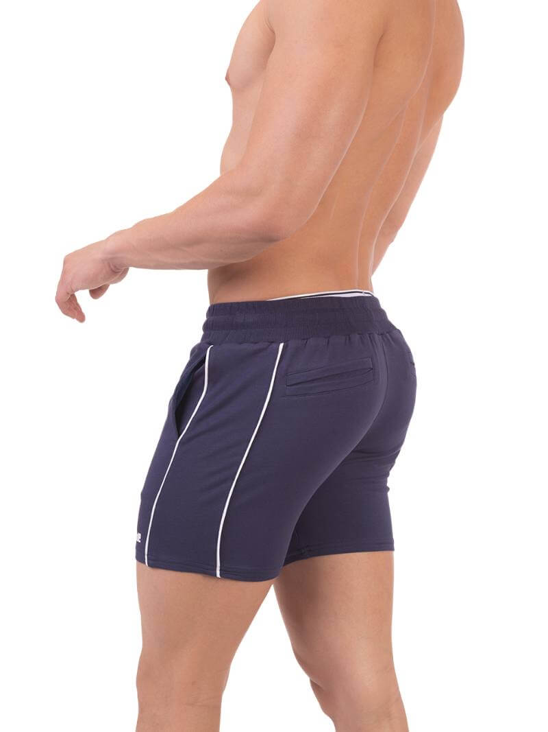 A model wearing red Barcode Berlin Lukio Casual Mid Thigh shorts with drawstring