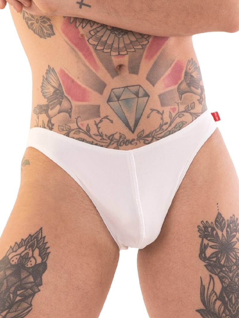 A person wearing red micro swimwear with a geometric pattern and the Barcode Berlin brand logo on the waistband.