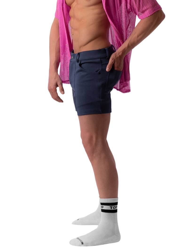 A pair of navy blue, short-leg Barcode Berlin Simon shorts with a pink, short-sleeve shirt in the background.