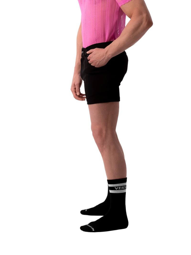 A pair of navy blue, short-leg Barcode Berlin Simon shorts with a pink, short-sleeve shirt in the background.