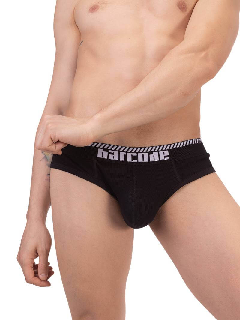 A man wearing a white Barcode Berlin brief with black trims and a brand logo on the waistband.