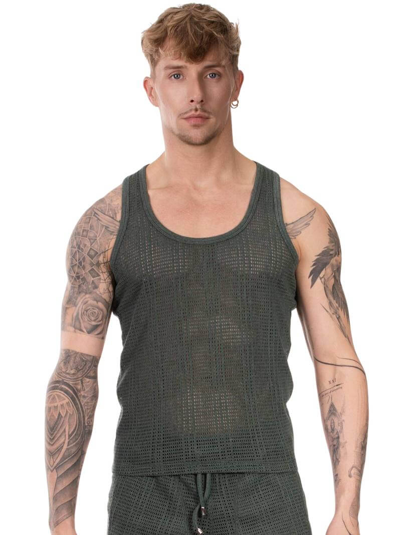 Man wearing a green tank top with tattoos on arms against a white background