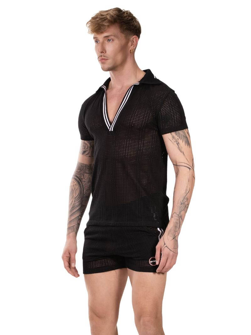 Man wearing a black mesh outfit with a white trim on a white background