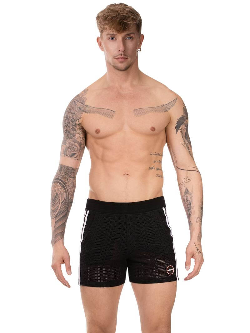 Man wearing black shorts with a white logo on a white background