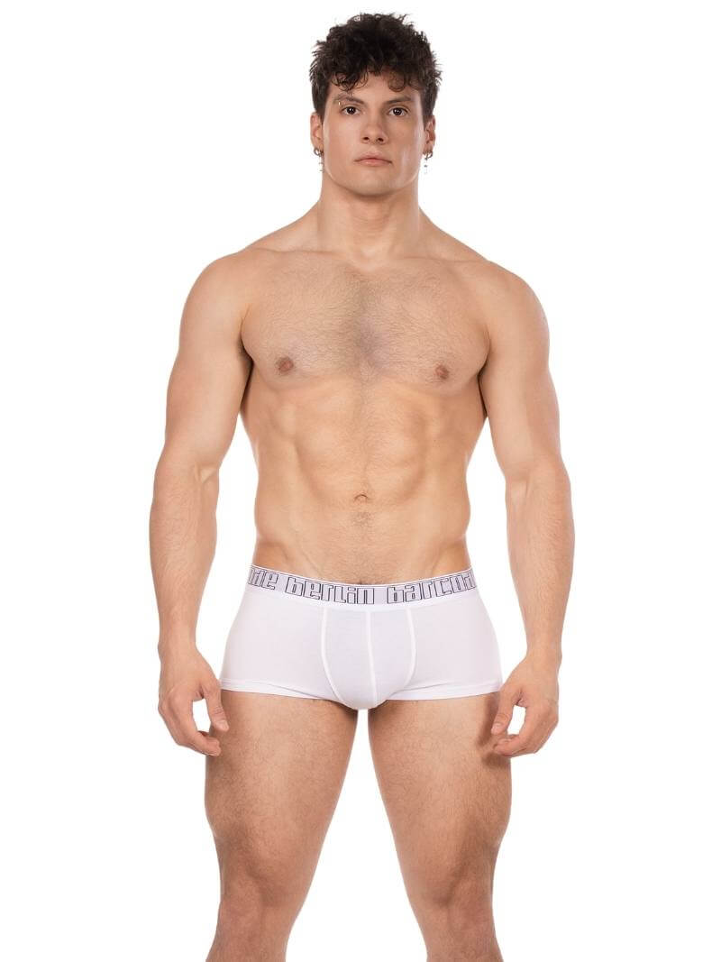 Man wearing white boxer briefs on a white background