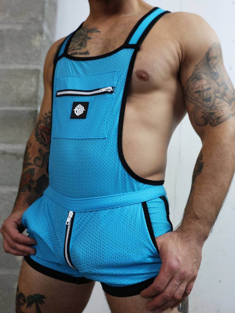 Person wearing a blue athletic outfit with a white logo on a neutral background