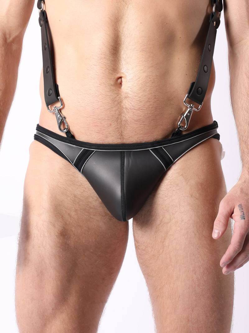 This image features the CellBlock13 Archer Neoprene Jock Brief, a stylish and provocative piece of fetish and kinky underwear. The jock brief is crafted from smooth, black neoprene rubber, emphasizing a sleek and moldable fit.