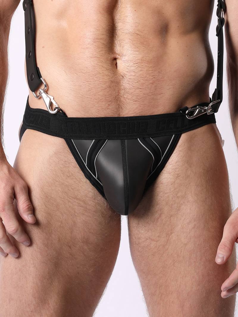 A model wearing a black neoprene jockstrap with colored piping and adjustable straps.