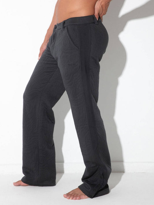 Side view of CODE 22 Quilted Snap-Detail Pants in charcoal