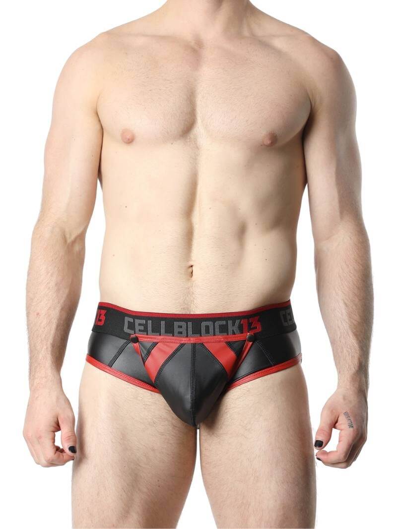 This image features the CellBlock13 Anti-Chrome Vegan Leather Jock Brief, designed with a sleek and matte black finish. The jock brief has contrasting trims that add a touch of color and style, and it features a bold "CELBBLOCK13" branding on the waistband.