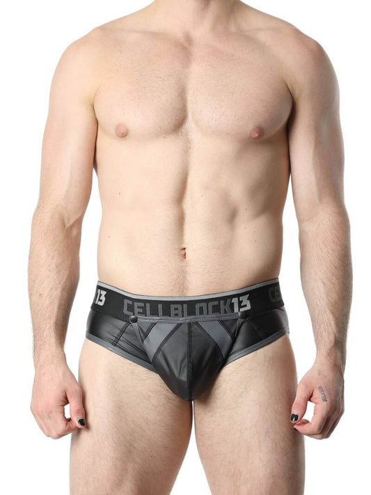This image features the CellBlock13 Anti-Chrome Vegan Leather Jock Brief, designed with a sleek and matte black finish. The jock brief has contrasting trims that add a touch of color and style, and it features a bold "CELBBLOCK13" branding on the waistband.