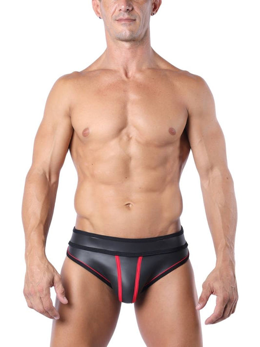 A model wearing a black neoprene jock brief with colored and striped piping, and matching colored jock straps. The waistband features a jacquard logo with 'CellBlock13' branding.