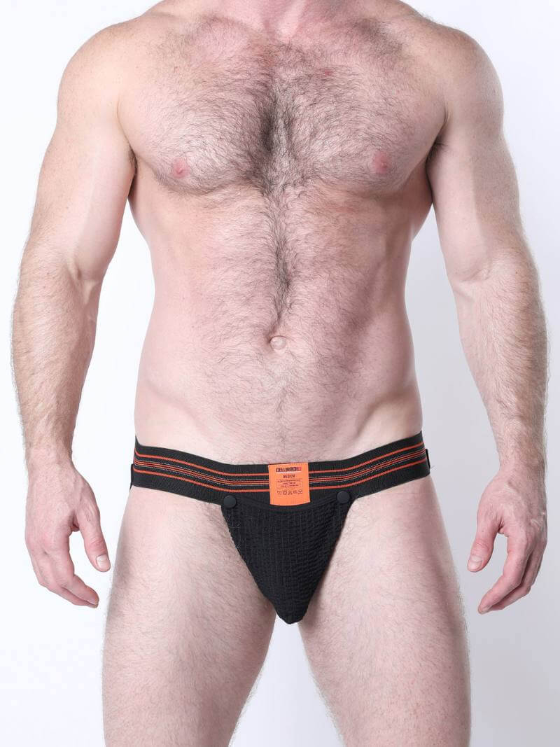 Man wearing black men's underwear with orange waistband on a white background