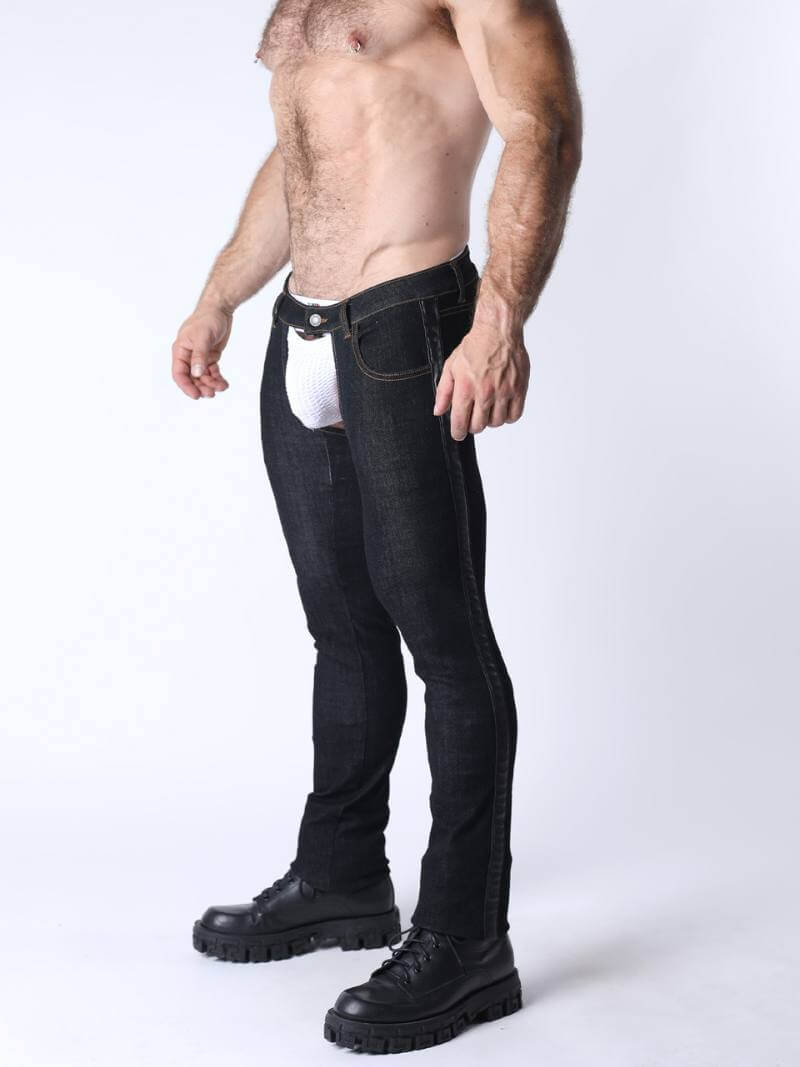 Man wearing black jeans and black shoes on a white background
