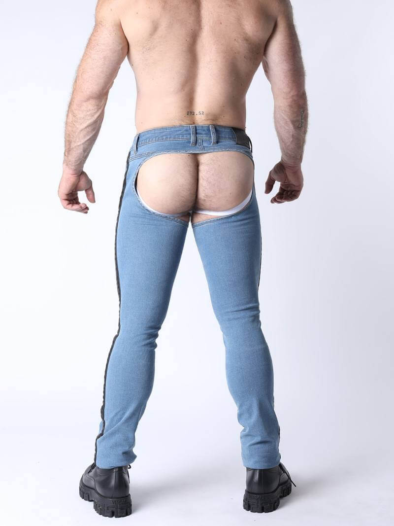 Person wearing light blue jeans with a sheer lining on a white background