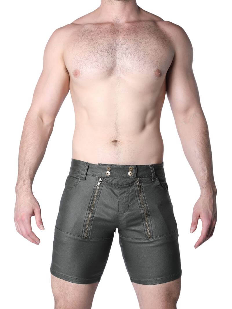 Man wearing dark green leather shorts on a white background