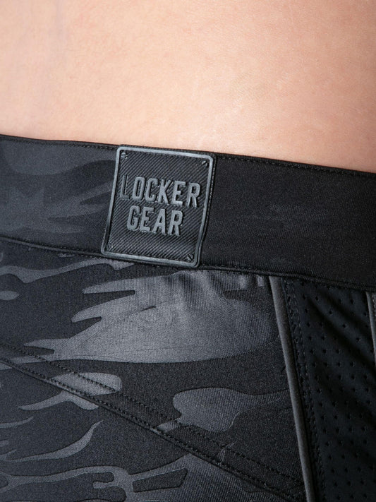 Black camouflage shorts with a visible 'Locker Gear' logo on a person wearing them.