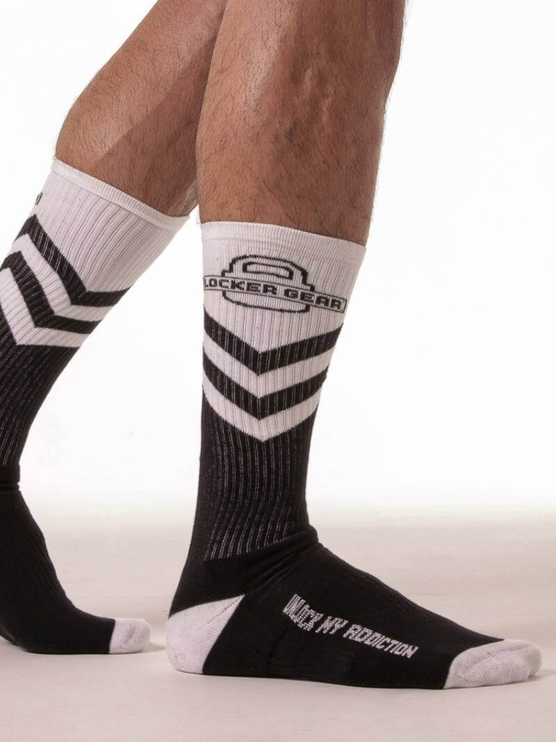Black and white socks with visible branding on a plain background